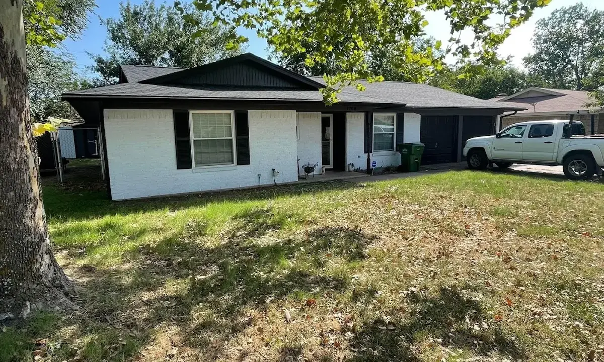 Professional roofing crew working on a residential roof in Oregon